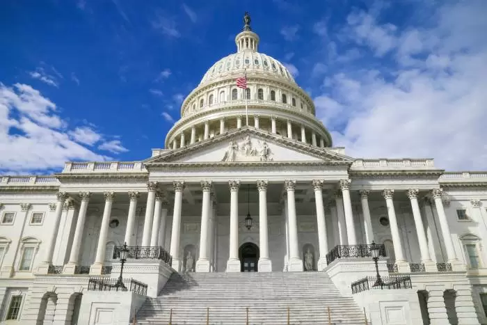 Congress building in Washington, DC against a blue sky