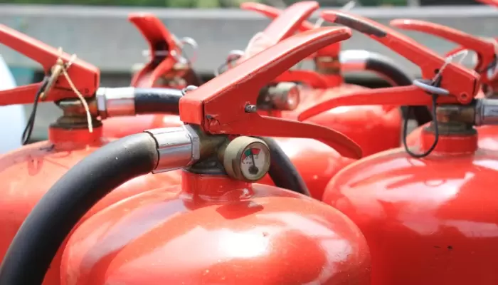 a close-up of several fire extinguishers